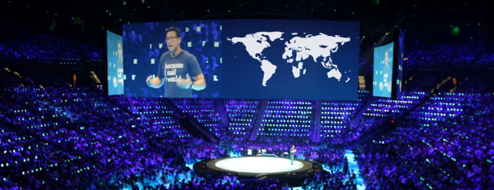 Alex Sheen standing in front of an audience in a stadium